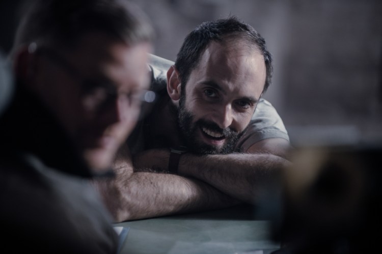 Director Dave Lambert smiles on the set.